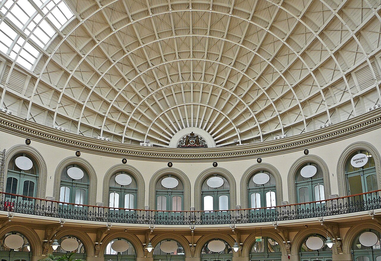Arched roof and curved galleries inside Leeds Corn Exchange
