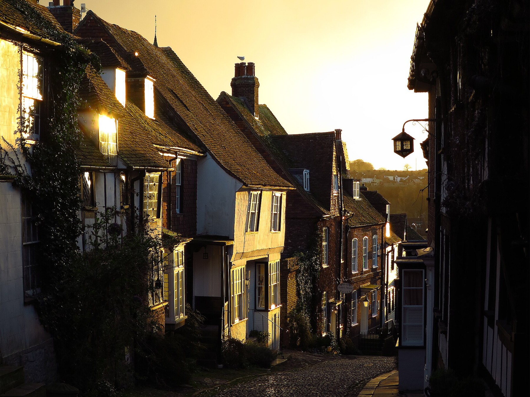 Late sunlight on historic houses along Mermaid Street in Rye