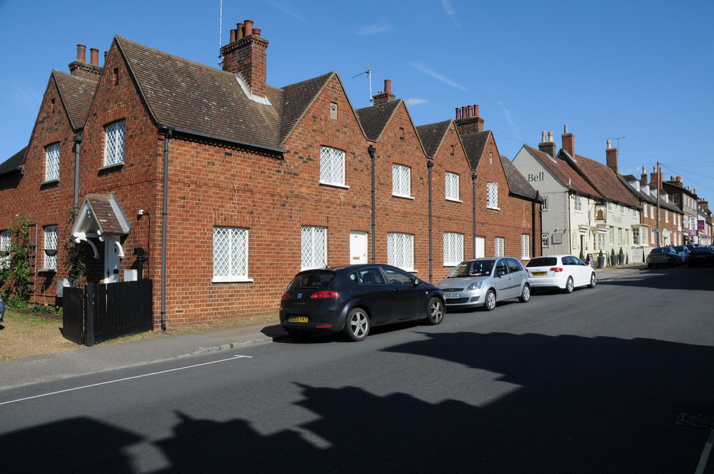 Brick and rendered buildings along a sunny Woburn street